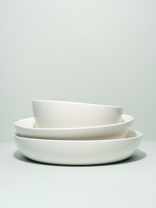 Stack of assymetrical serving bowls